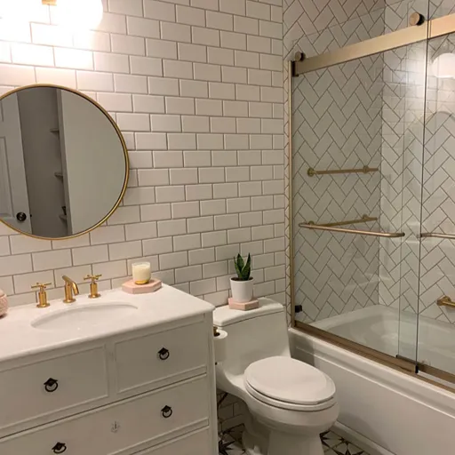 Subway tile with glass shower and patterned tile flooring installation 